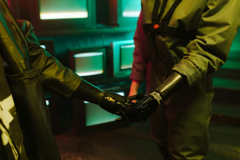 A compelling handshake featuring modern prosthetic arms in an industrial environment.